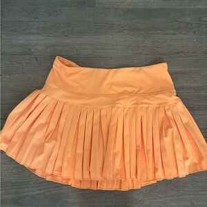 Gold hinge orange skirt